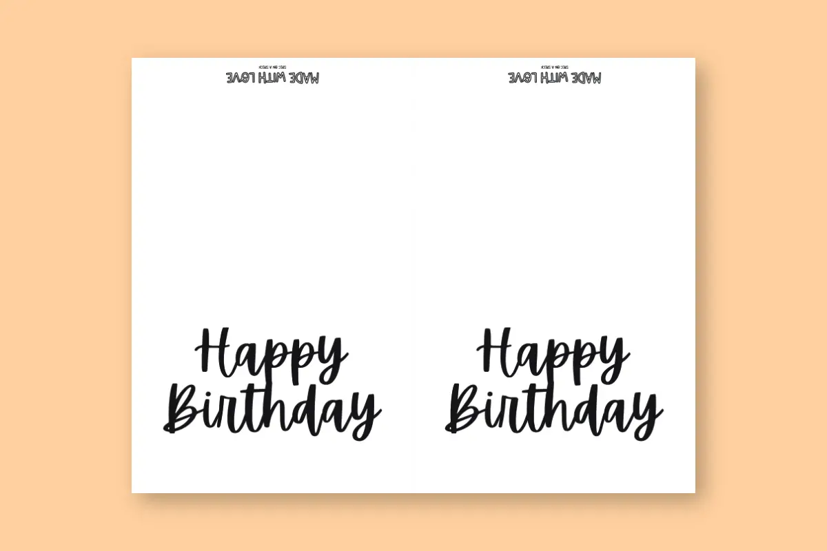 Black and white happy birthday card written in cursive on white card