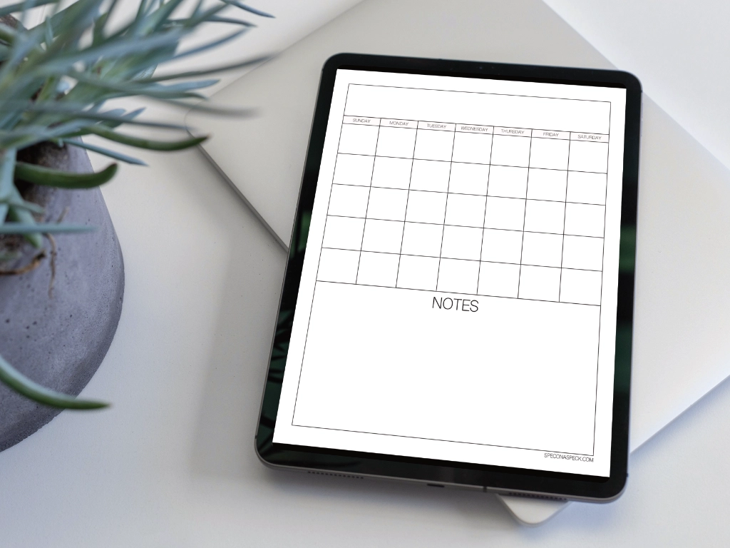 goodnotes calendar template on iPad next to a plant