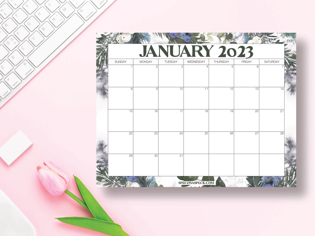 Calendar for January 2023 on a pink desk