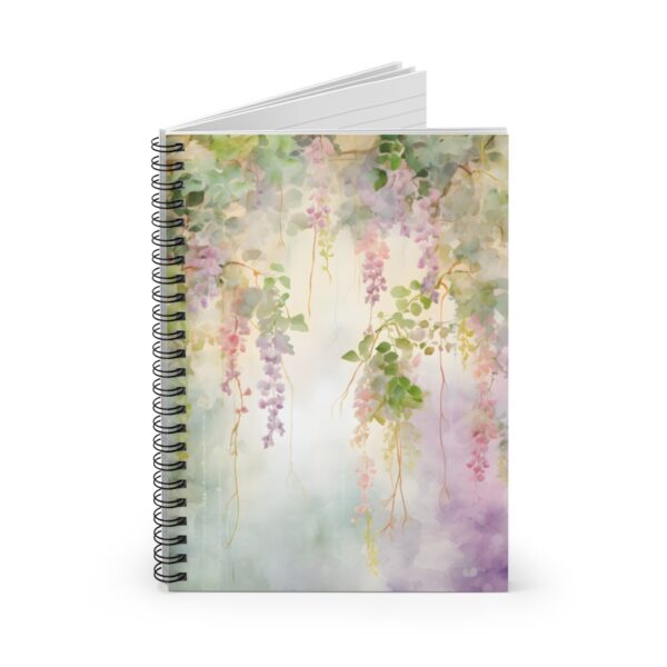 a spiral notebook with a cover showing vines and flowers